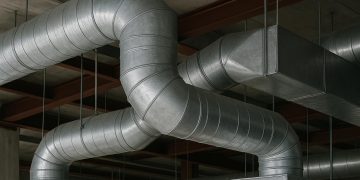 Complex commercial ductwork installation at Vamco Sheet Metal Inc in a large building project